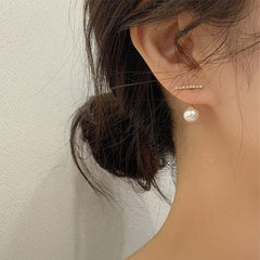 Elegant metal earrings featuring a modern design, perfect for enhancing any formal attire.
