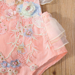Elegant ruffle sleeve blouse featuring intricate floral embroidery for a sophisticated look.