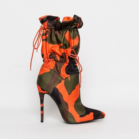 A pair of stylish high heels paired with elegant calf boots for a sophisticated footwear collection.
